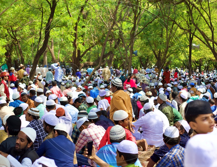Muslims performing prayers in an Eidgah.