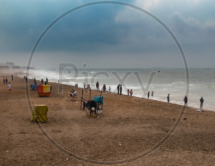 People/Group of people enjoying the beach view at Rama Krishna beach (R.K.Beach), Vishakapatnam/Vizag.