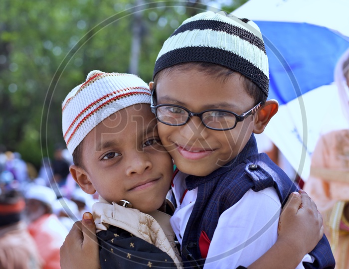 Muslim kids smiling at camera.