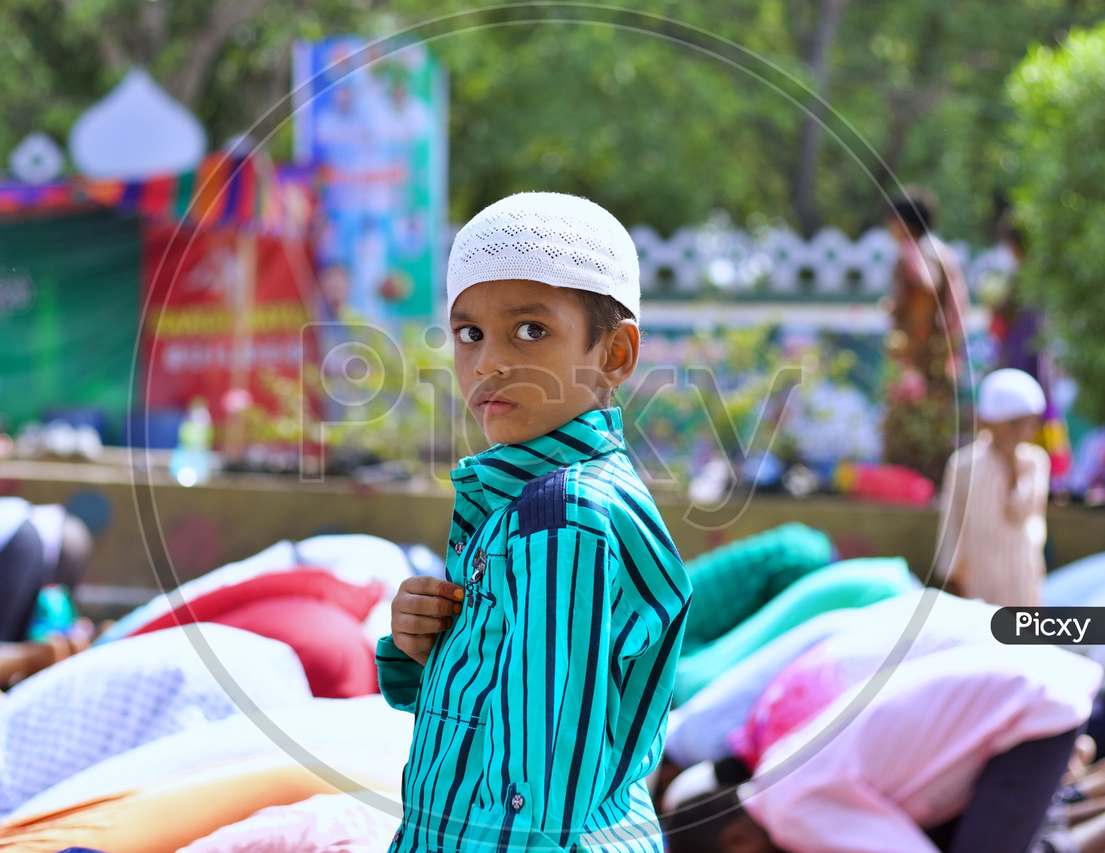 Muslim kid looking at camera.