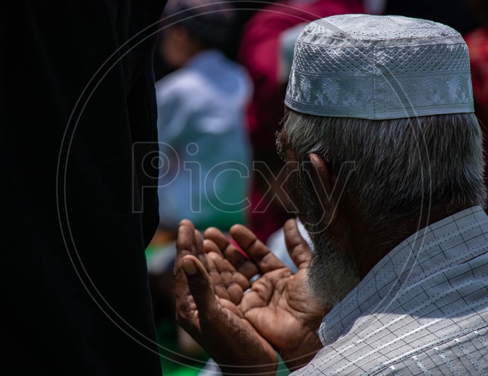A Muslim Old Man Offering Prayer Or Namaz  At Mecca Masjid  Or Mosque  Near Charminar During The Alvida Jumma  , The Last Friday Prayer In Ramzan or Ramadan Season