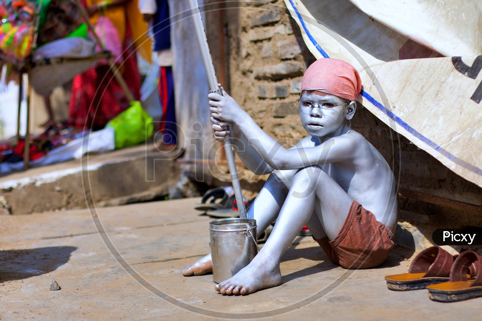 Small kid painted himself as Gandhi.