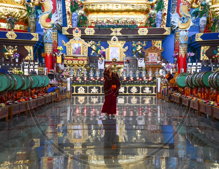A buddhist monk walking during the daily rituals
