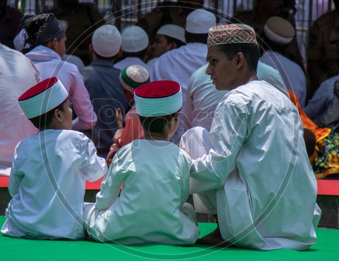 A Muslim  man With His sons At Alvida Jumma