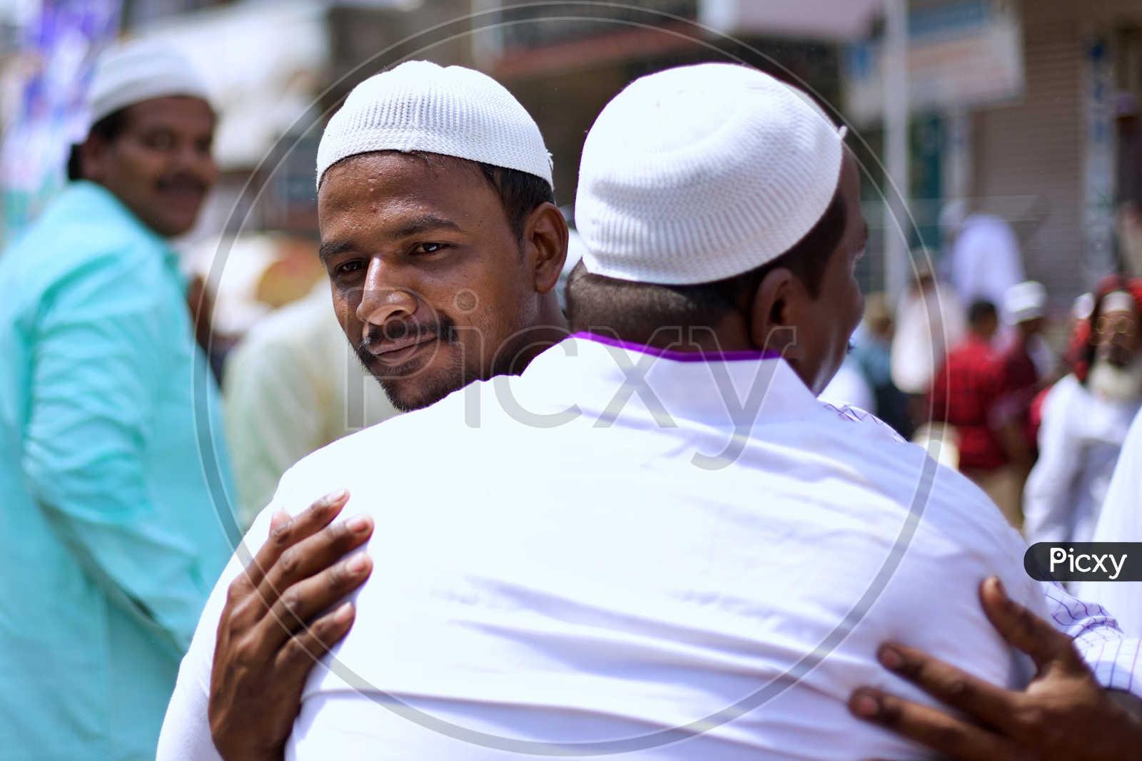 Muslim doing hug on the occasion of EID.