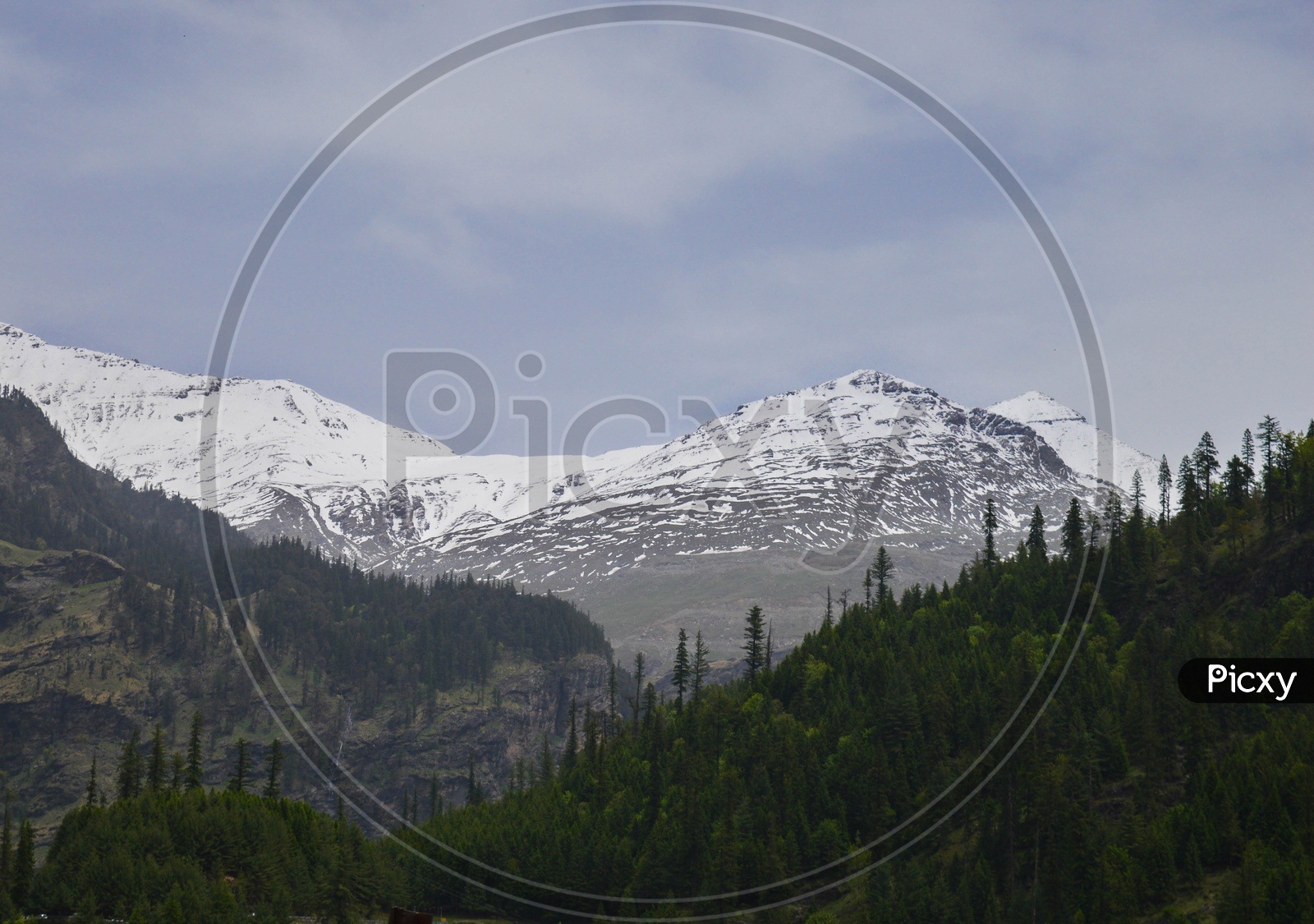 A View Of Snow Capped Mountains With Valley  View