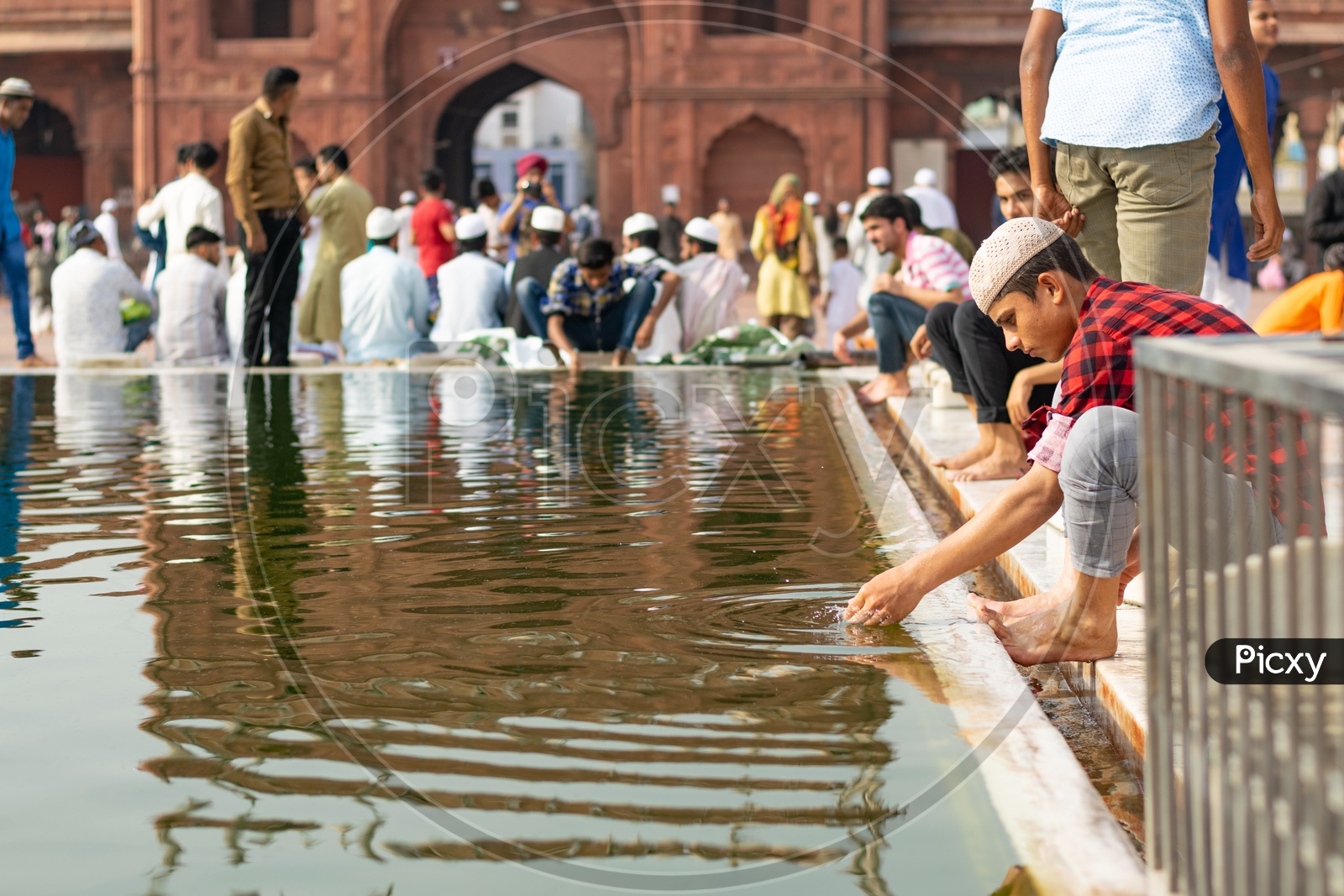 Man Performing 'Wudu' on the day of Eid-ul-Fitr (End of the holy month of Ramadan) at Jama Masjid, Delhi
