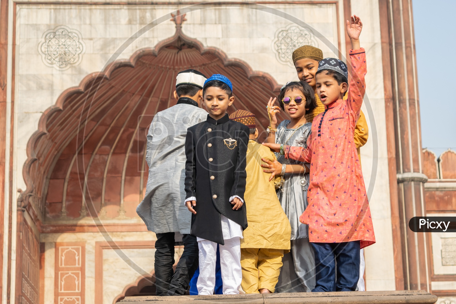 Children posing for photos on the day of Eid-ul-Fitr (End of the holy month of Ramadan) at Jama Masjid, Delhi