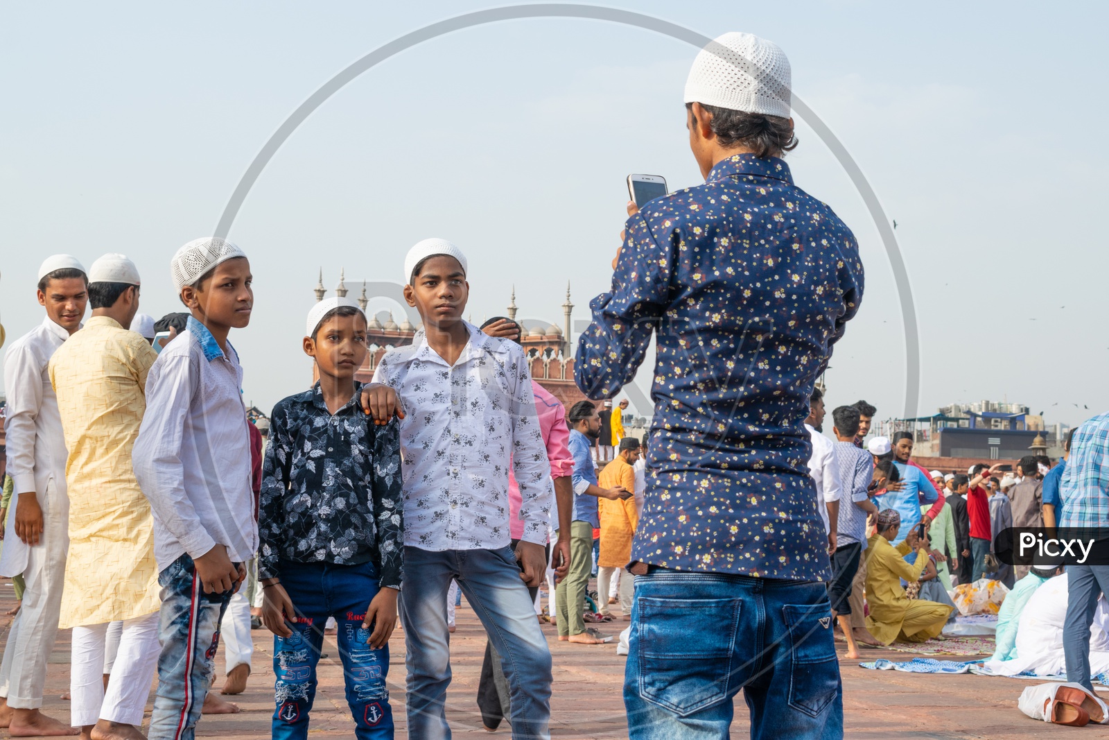 Clicking photos after the Namaz on the day of Eid-ul-Fitr (End of the holy month of Ramadan) at Jama Masjid, Delhi