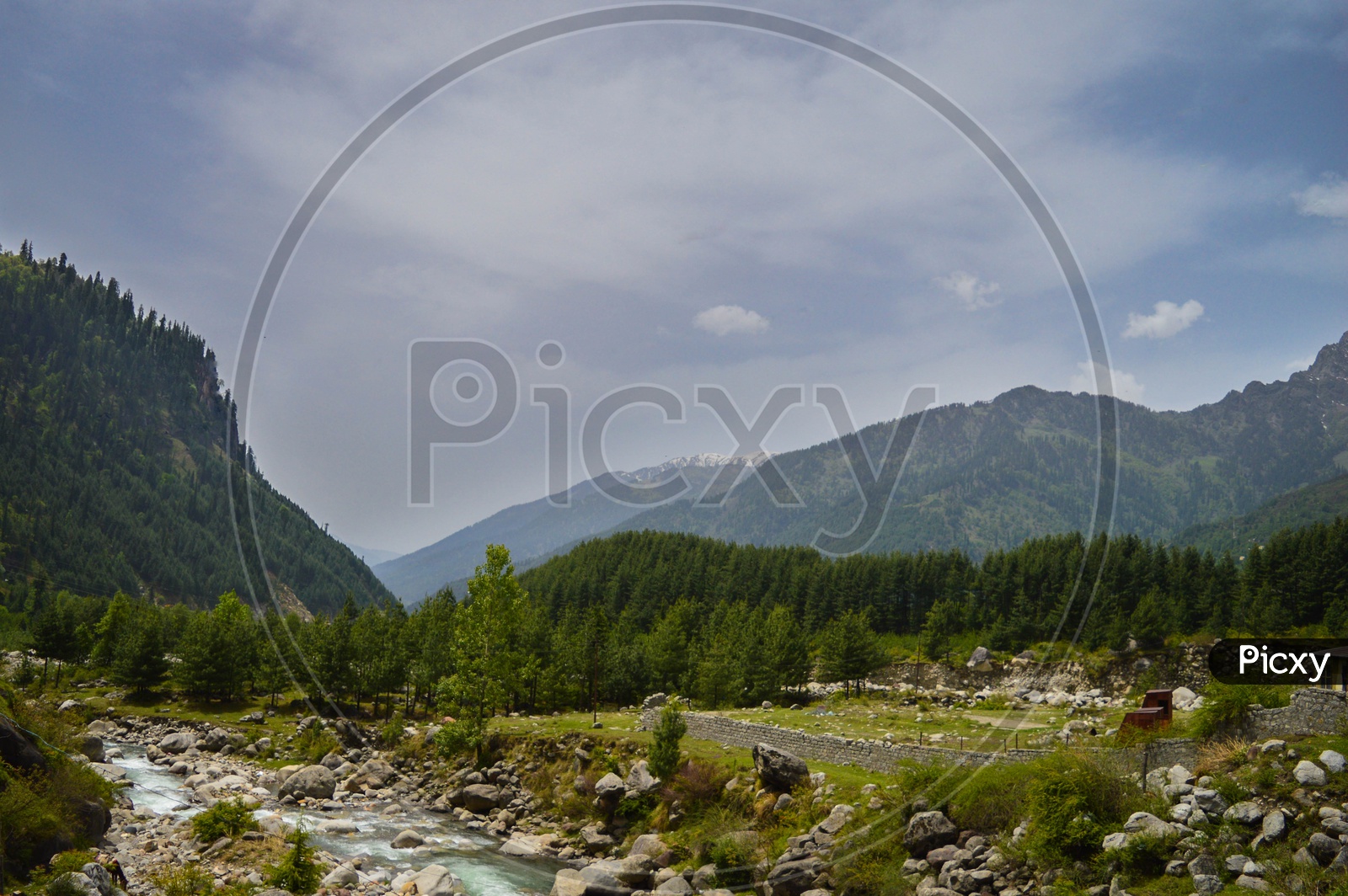 River Flowing In The Valleys Of Rohtang Pass With Mountain View