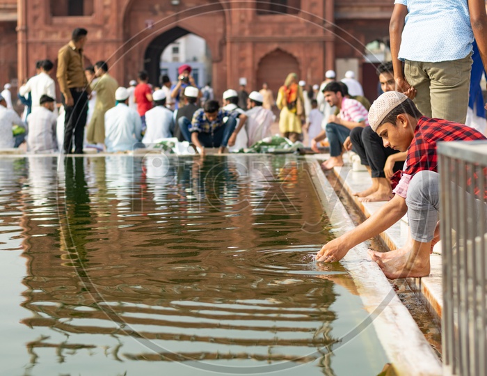Man Performing 'Wudu' on the day of Eid-ul-Fitr (End of the holy month of Ramadan) at Jama Masjid, Delhi