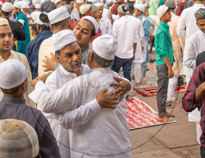 Men hugging each other after the Namaz on the day of Eid-ul-Fitr (End of the holy month of Ramadan) at Jama Masjid, Delhi