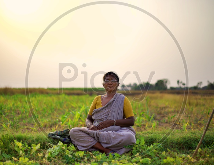 A villager sitting in farm.