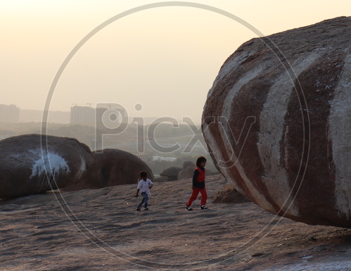 Children Playing on Rock Hill