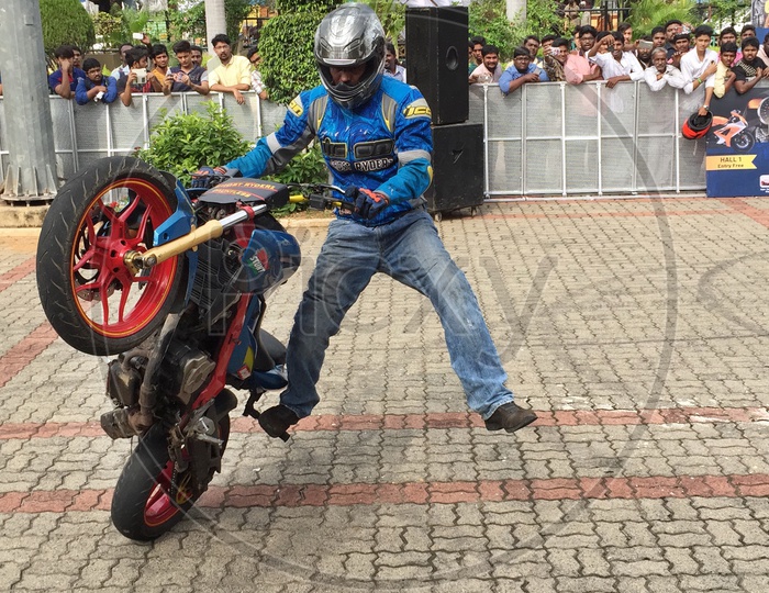 A Man Doing Stunts  With Race Bike