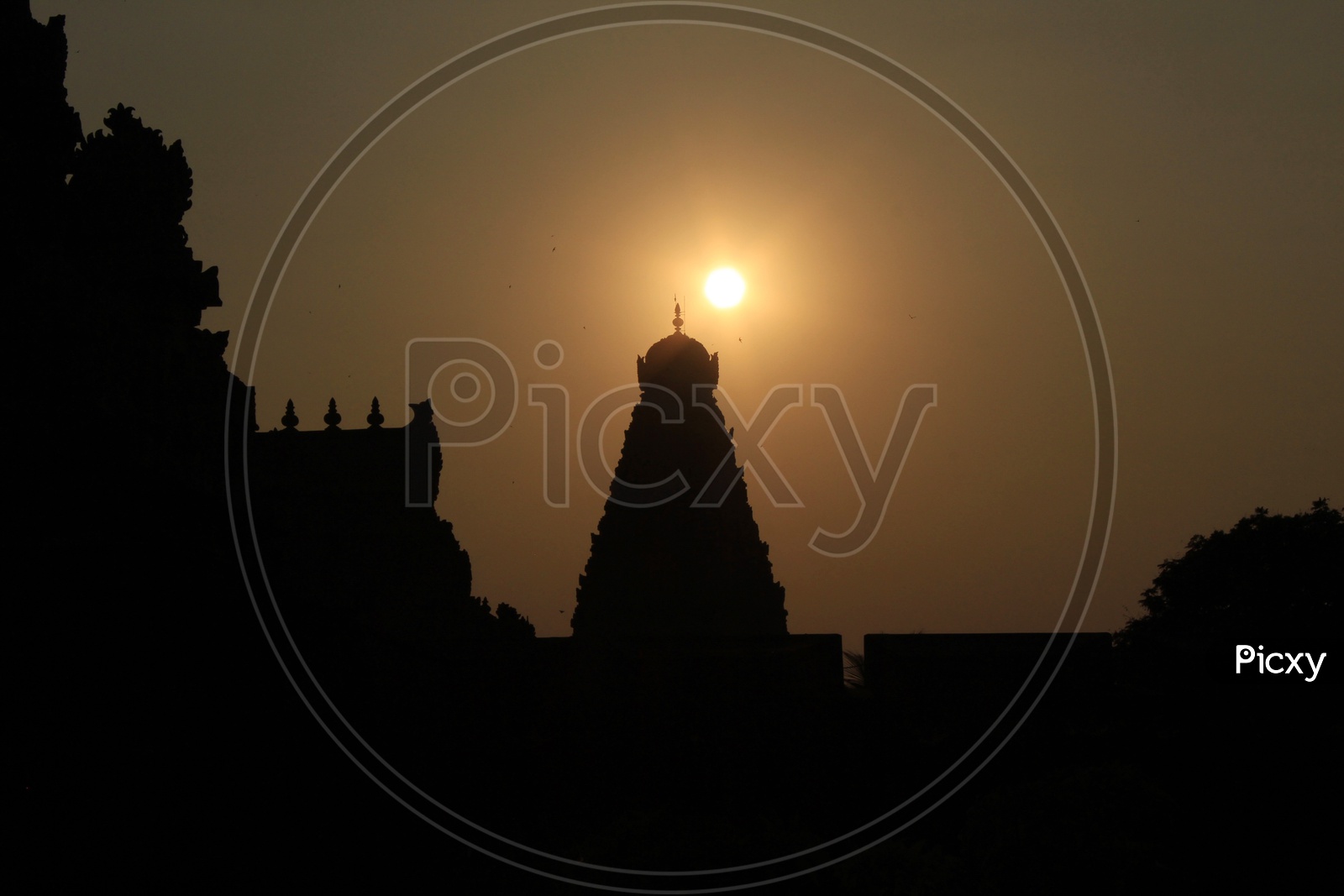 Silhouette Of Brihadeswarar Temple Shrine  With Sunset Sky In Background