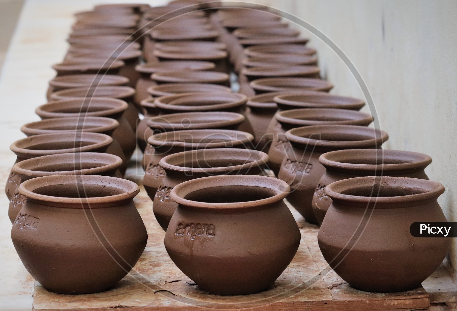Freshly Sculpted Clay Pots Or Pottery By The Professional Potter Kept For Drying