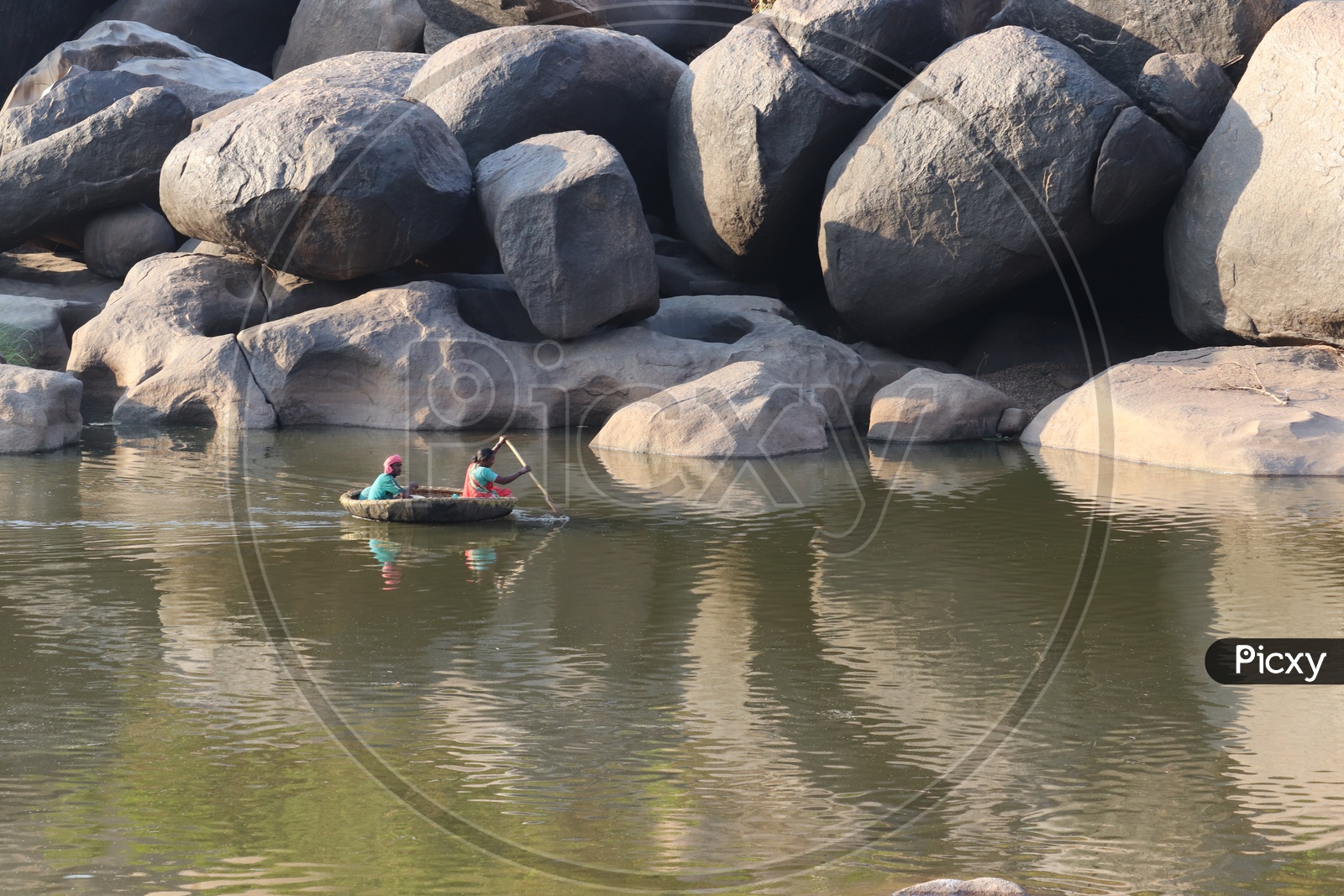 Coracle Boating On Tungabadra River  Between The Rocks In Hampi