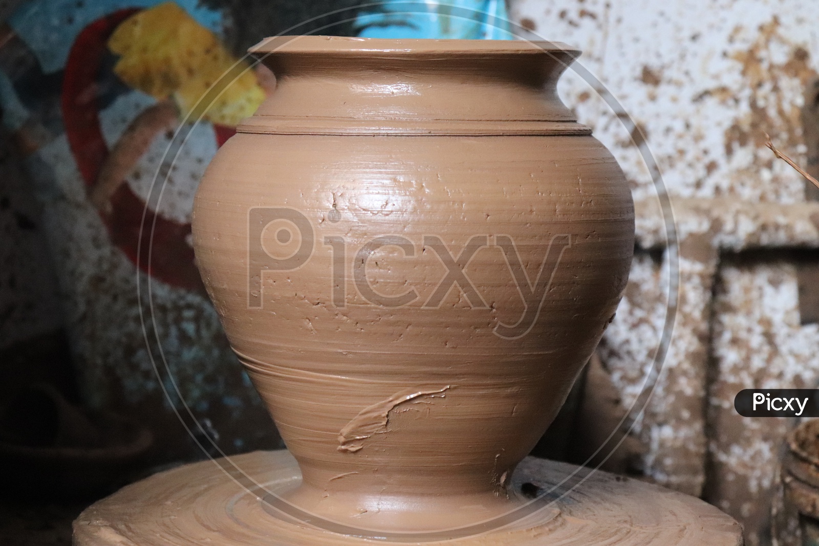 A Freshly Sculpted Clay As a Pot By a Potter on Pottery Wheel