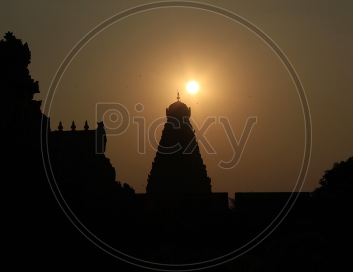 Silhouette Of Brihadeswarar Temple Shrine  With Sunset Sky In Background