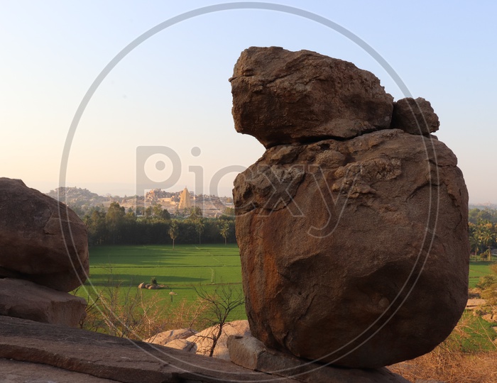 Rocks On The Hills Of  Hampi With Views Of Paddy Fields