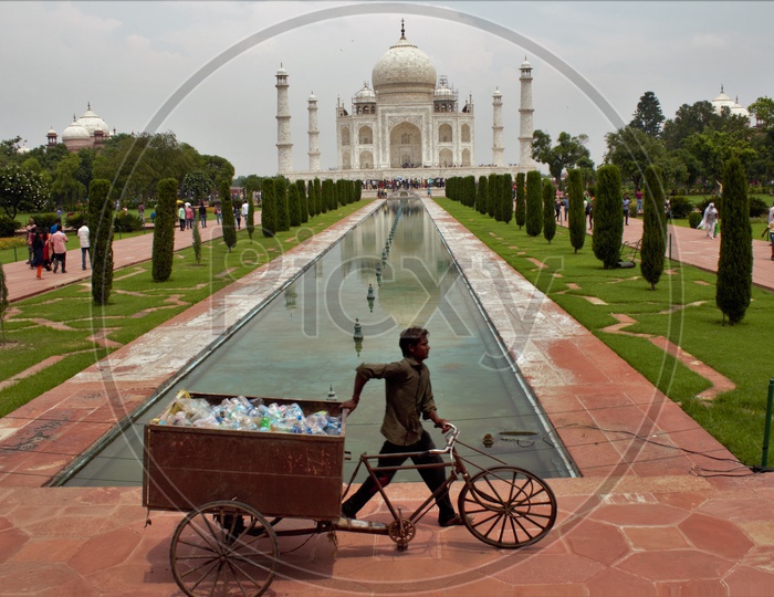 A Sanity Cleaner Carrying The Plastic Thrown Around Taj Mahal In a Rickshaw