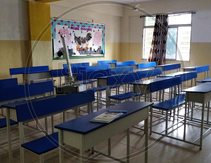 Empty class room with benches