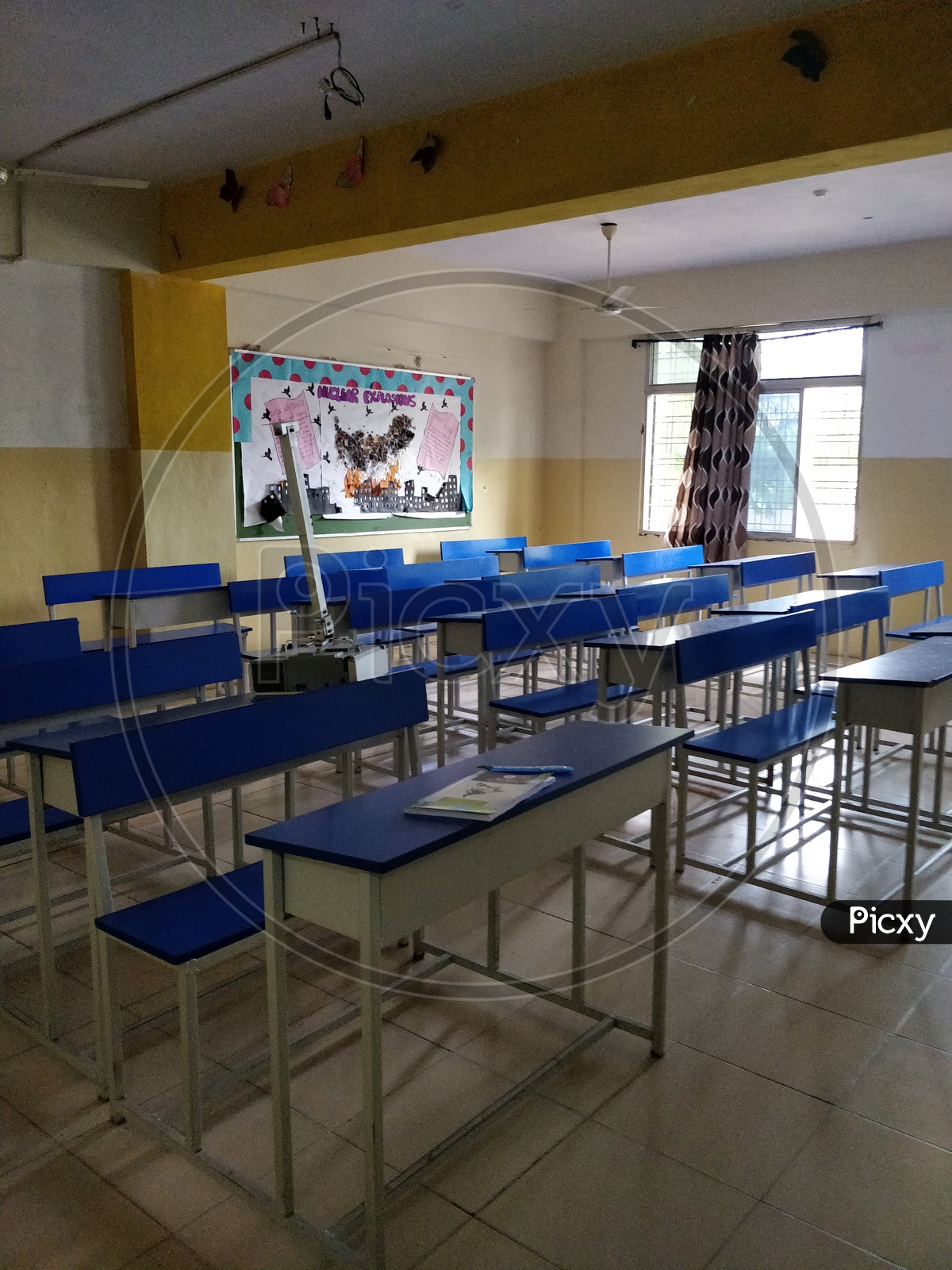 Empty class room with benches