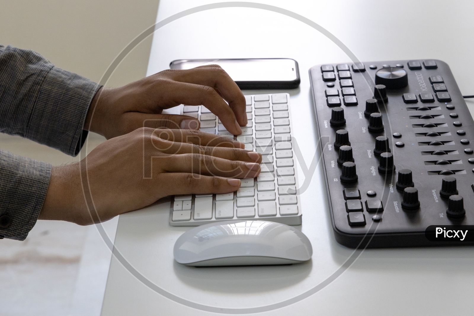 Closeup Of  Man Hands or Fingers  Working On Computer Keyboard at Office Desk