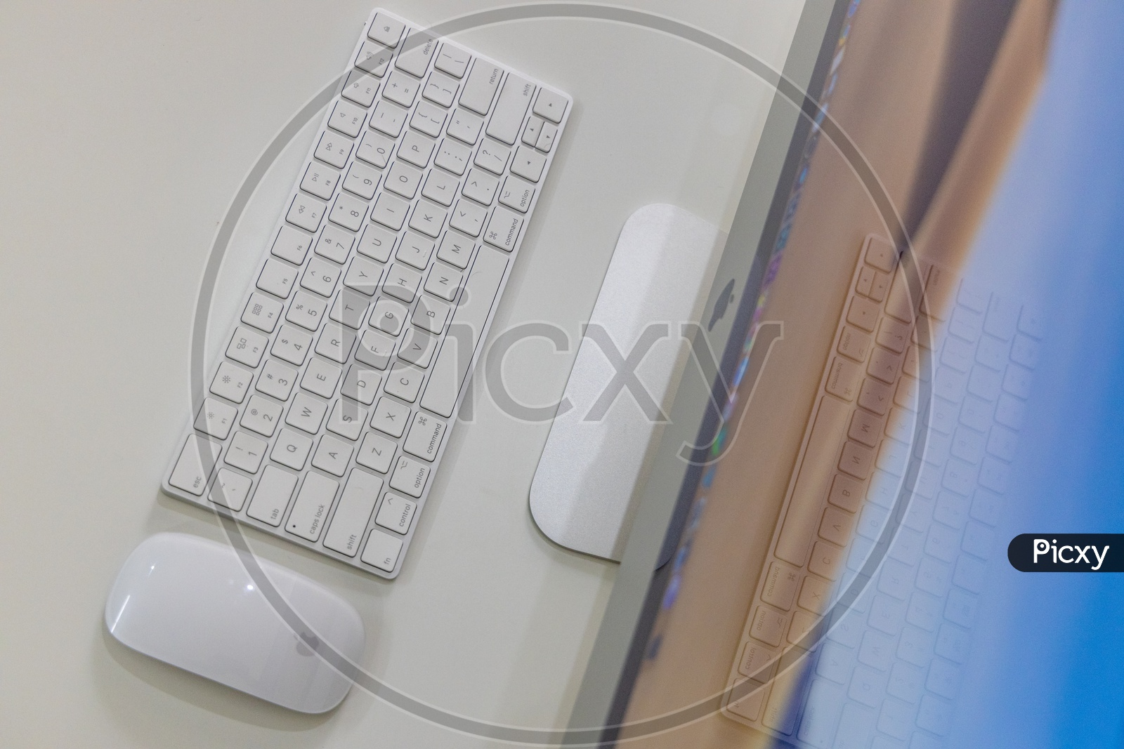 Top View Of Keyboard And Wireless Mouse  on a  Office Desk  Over a White Isolated Background