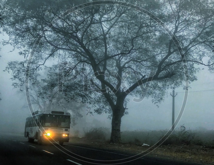A Bus on the Inter State Roads in Foggy morning