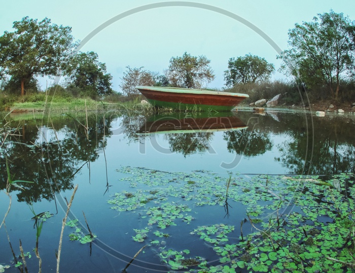 A Lone Coracle Boat In a Lake Water