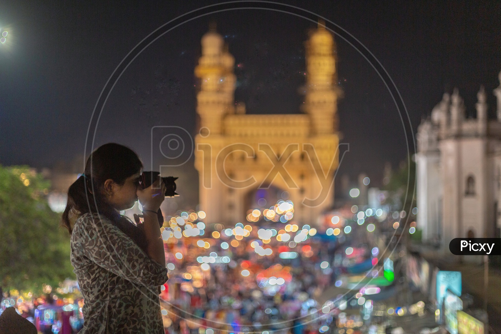 A Lady Or Woman Photographer Clicking The Charminar Streets