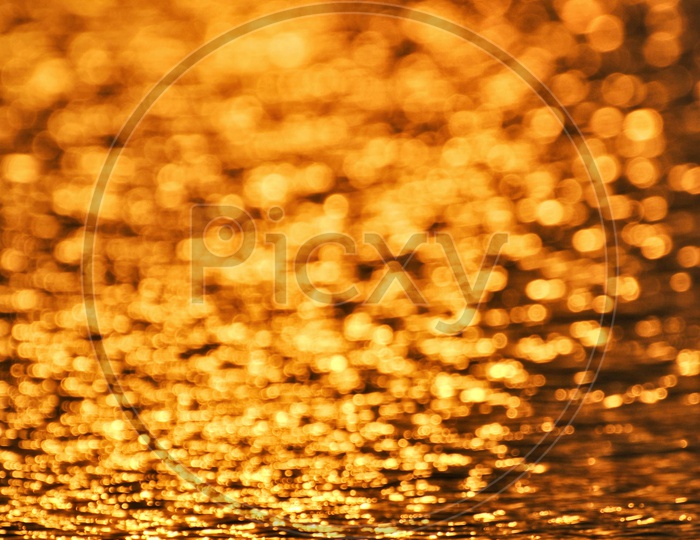 Golden Colour Of Light Over the Water Surface