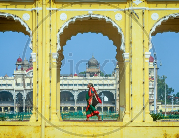 An Old Woman Walking At The Compound Of Mysore Palace