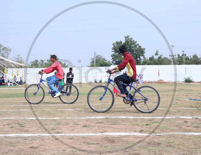 Indian Young School Boys Participating In a Cycle Race Competition In a School Sports Day Or Athletic Meet