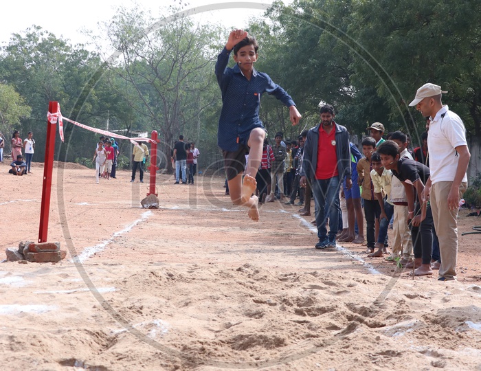 Image of Indian School Students Or Children Participating In Long Jump ...