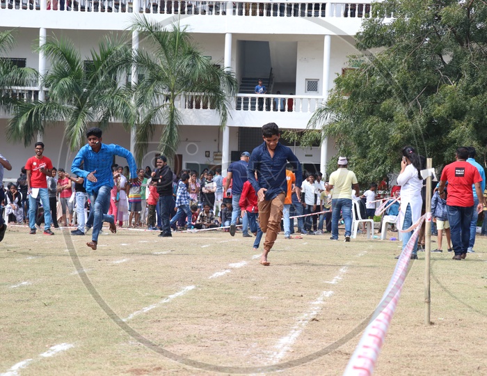 Indian Young School Boys Participating In a  Running Race  Competition In a School Sports Day Or Athletic Meet