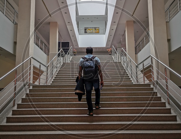 Student climbing the steps in Academic Block in ISB (Indian School of Business) Campus