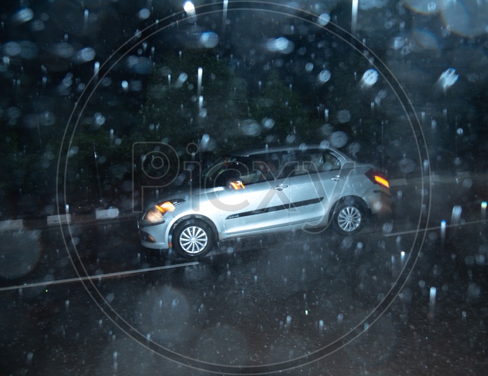 Drenching Commuting Vehicles in Monsoon Rains or Heavy Rain Fall On The urban City Roads