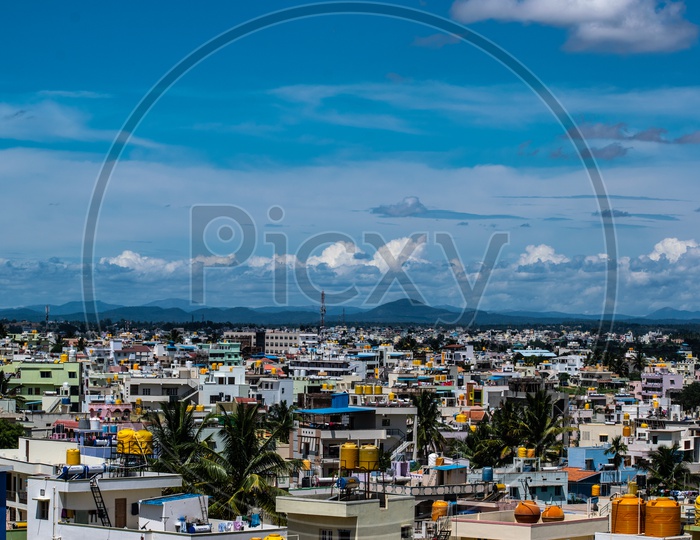 City Scape Of Halebeedu  Town With Cotton Clouds And Blue Sky