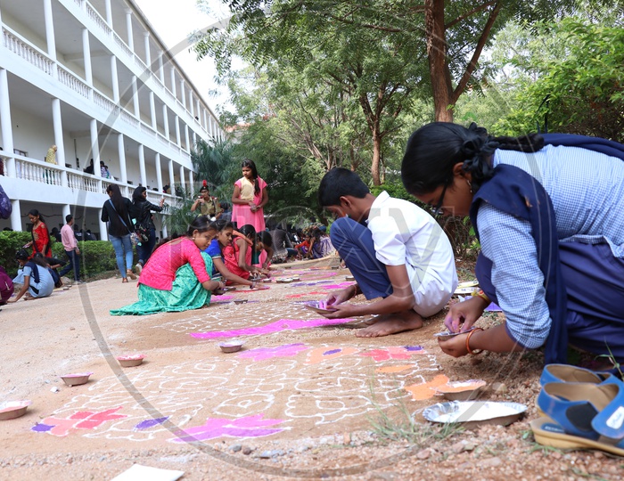 Indian School Girls Participating In Rangoli Competition