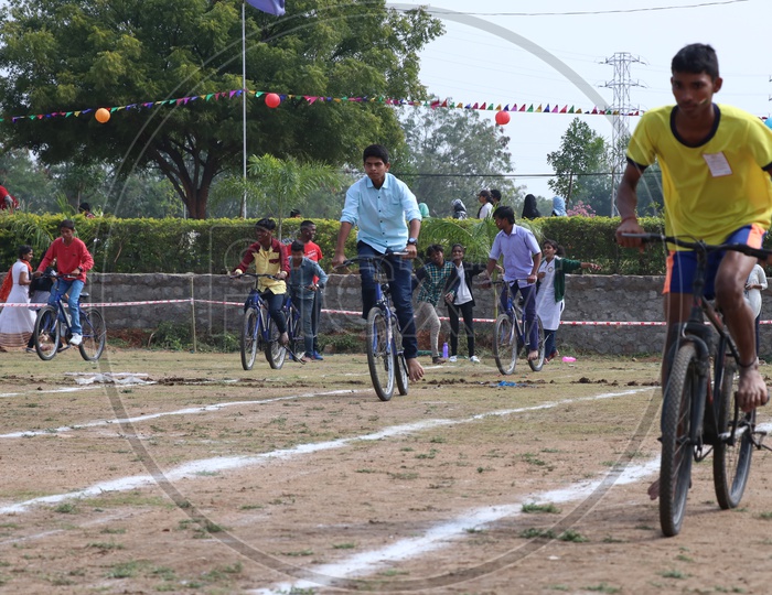 Indian Young School Boys Participating In a Cycle Race Competition In a School Sports Day Or Athletic Meet