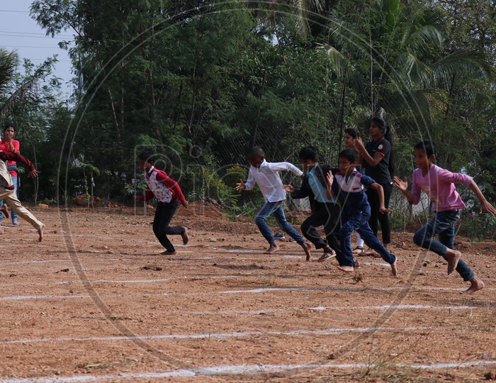 Boy  Students Participating In a School Running Race Competition
