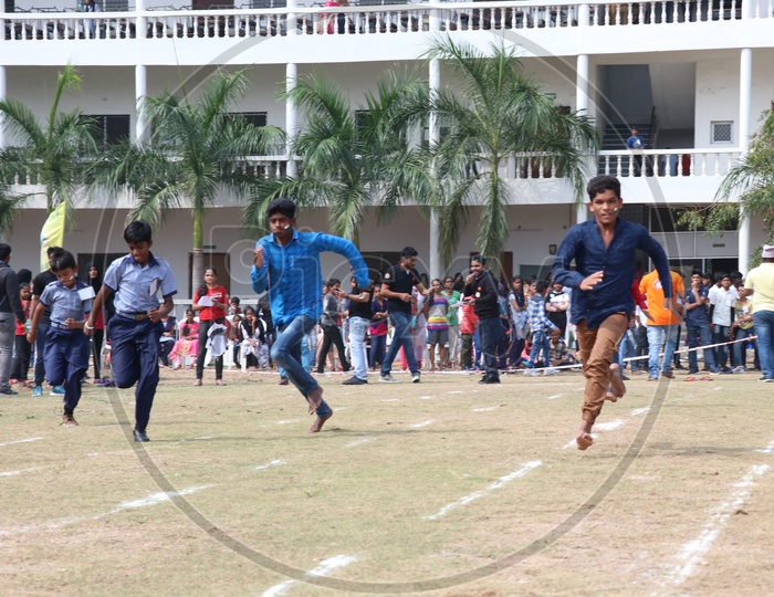 Indian Young School Boys Participating In a  Running Race  Competition In a School Sports Day Or Athletic Meet