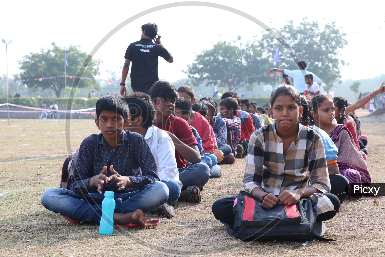 School Students Or Children Sitting In  Queue Lines