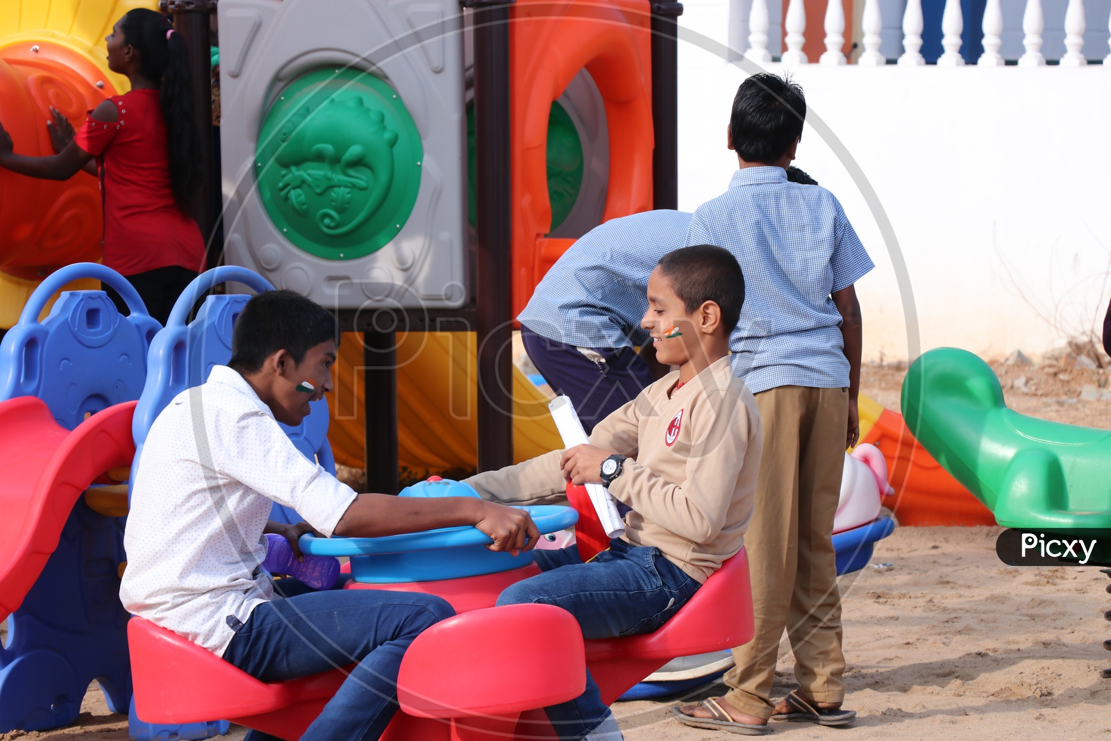 Children Playing With   Equipment in  Playing area  in a Park