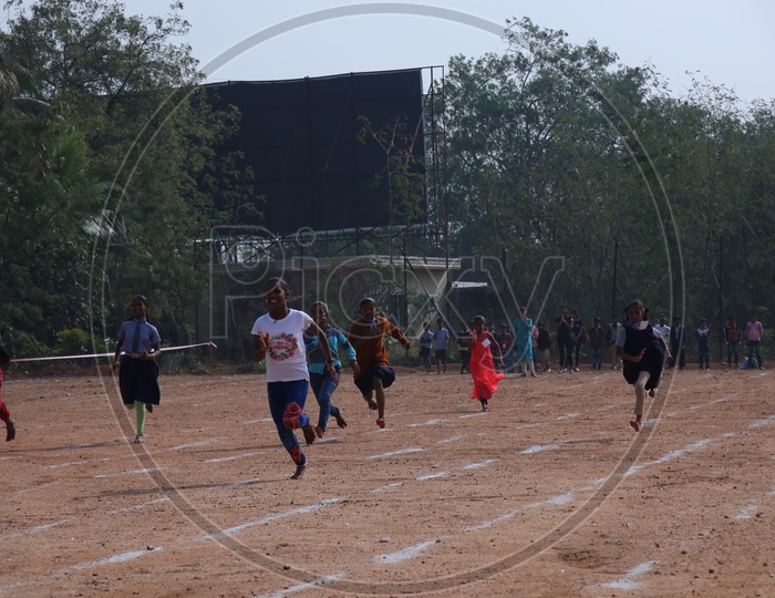 Girl Students Participating In a School Running Race Competition
