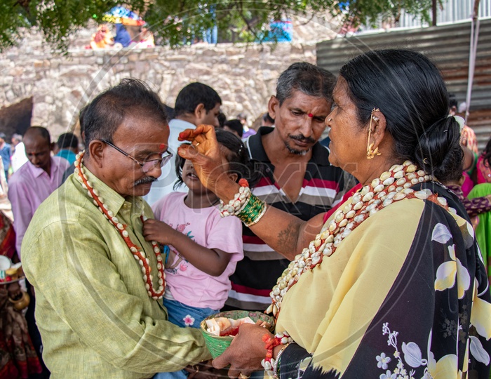Devotees Taking Blessings From Maata Or  Goddess Woman At Bonalu