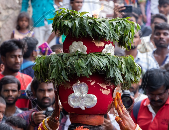 A Woman   Carrying Bonam or Bonalu On Her Head At Golconda